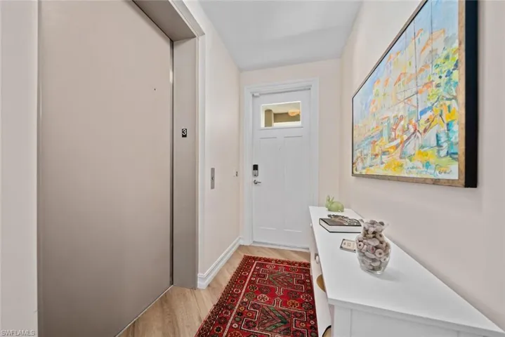 Doorway featuring light hardwood / wood-style flooring