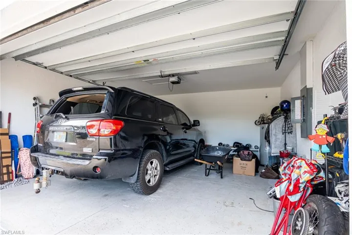Garage featuring a garage door opener