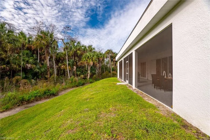 View of yard featuring a sunroom