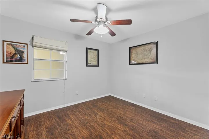 Spare room featuring hardwood / wood-style floors and ceiling fan