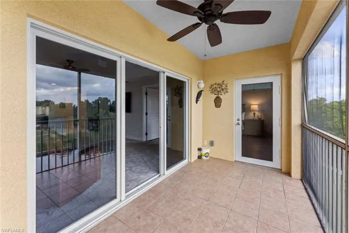 Unfurnished sunroom with ceiling fan and a healthy amount of sunlight