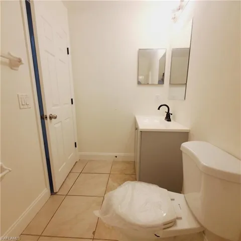 Bathroom featuring vanity and light tile patterned floors