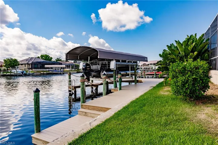 Dock area featuring a water view