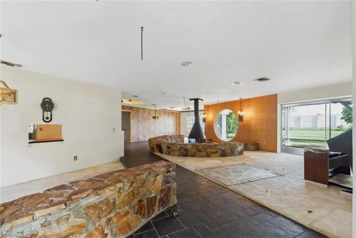 View front front door showcasing formal dining space, living room and fireplace areas