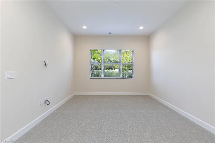Unfurnished room with light carpet and recessed lighting
