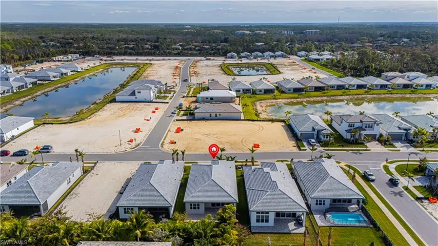 Aerial perspective of suburban area with a nearby body of water