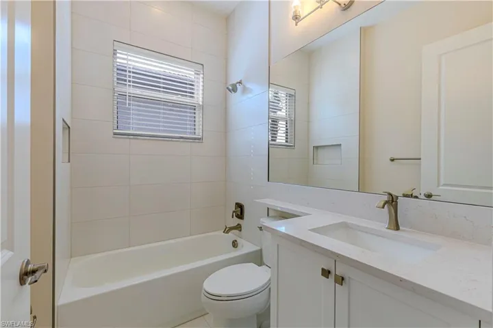 Full bathroom featuring vanity and  shower combination