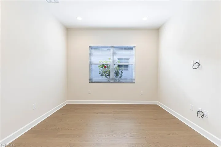 Spare room with light wood-style flooring and recessed lighting