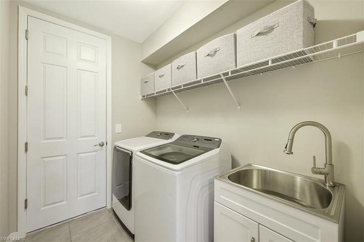 Laundry room with wash sink.