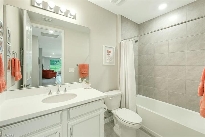 Full guest bathroom with tub.