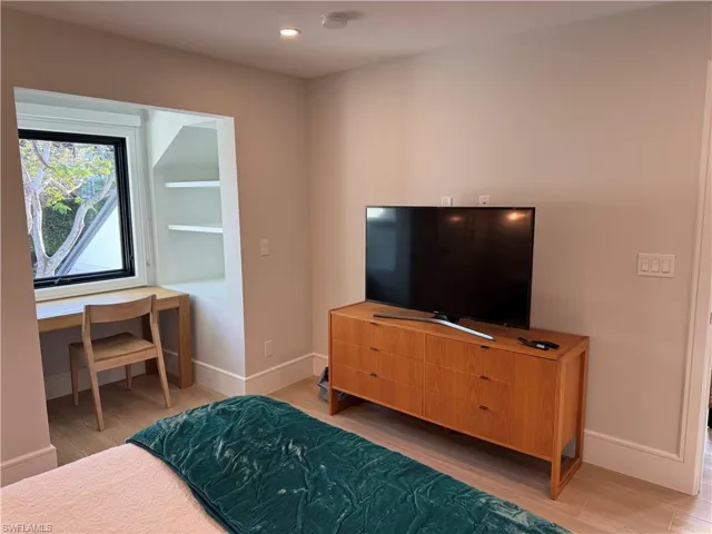 Queen Bedroom featuring hardwood / wood-style floors