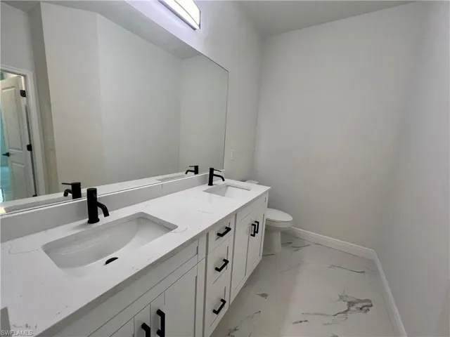 Bathroom with vanity and toilet