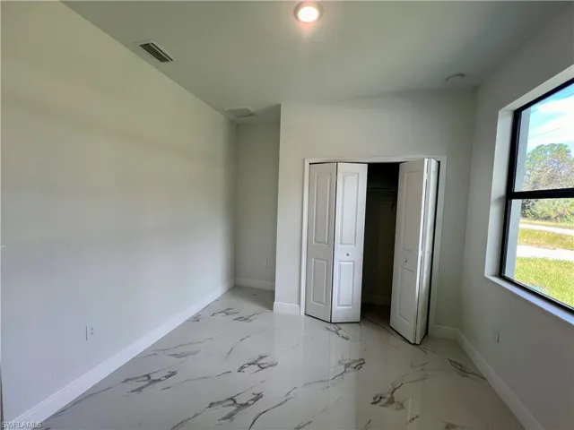 Den may double as 4th bedroom with a closet and multiple windows