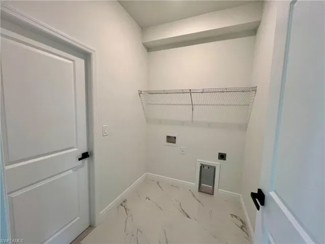 Clothes washing area with hookup for a washing machine and electric dryer hookup