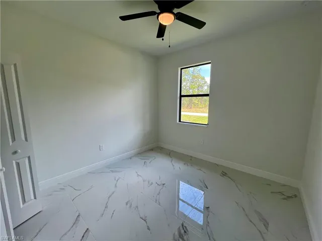 Guest bedroom with ceiling fan