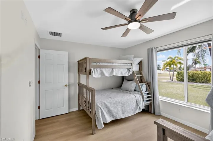 Bedroom featuring light wood-style flooring and ceiling fan
