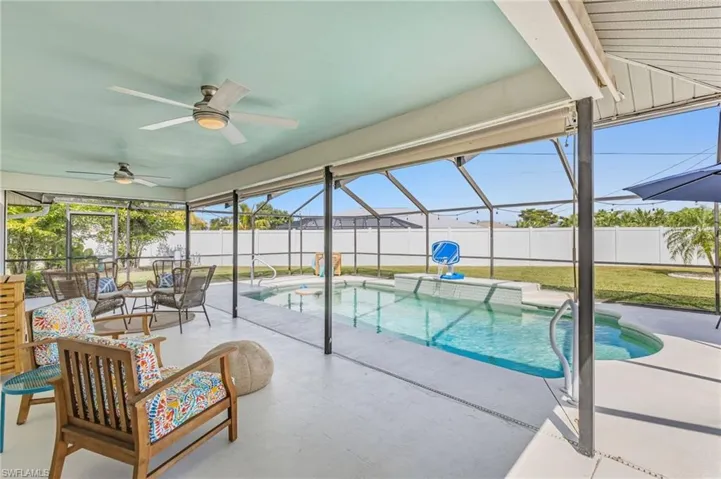View of pool with a lanai, a sunroom, a patio area, and a fenced backyard