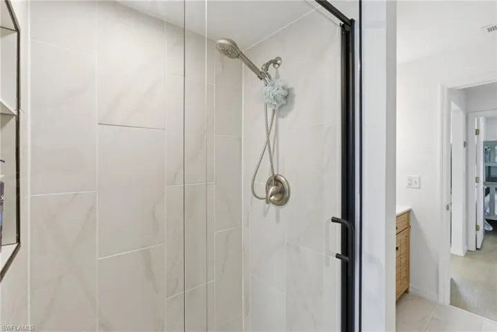 Full bathroom with a stall shower and vanity