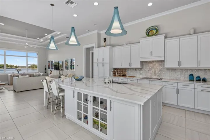 Abundant cabinetry, expansive workspace, and seamless flow to the great room.