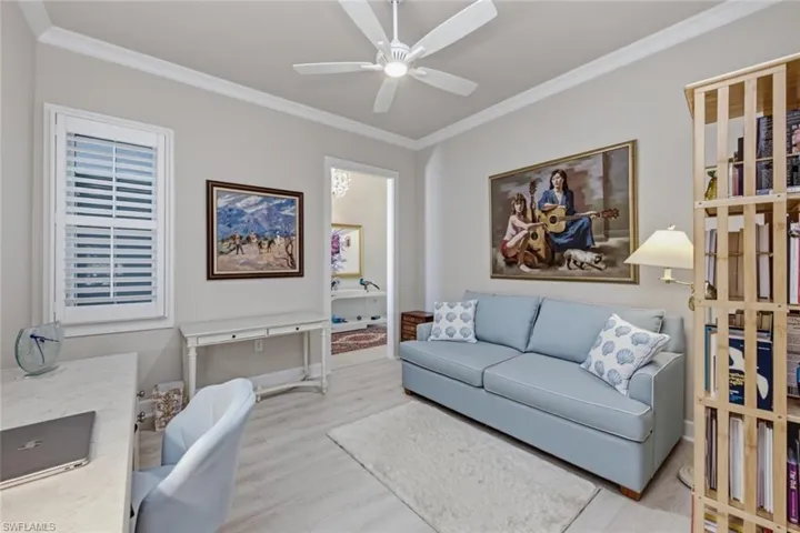 Spacious den offers flexibility as a home office, media room, or additional guest space.
