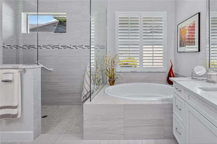 A spa-inspired bath with soaking tub, walk-in shower, and timeless finishes.