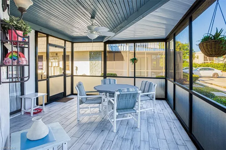 Sunroom / solarium featuring ceiling fan