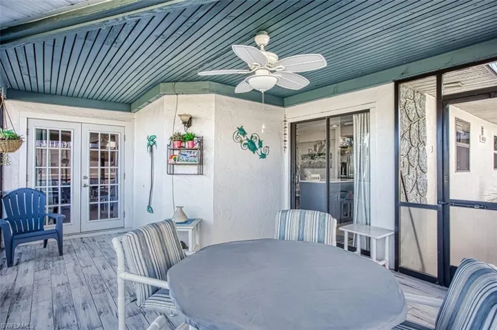 Sunroom featuring french doors and ceiling fan