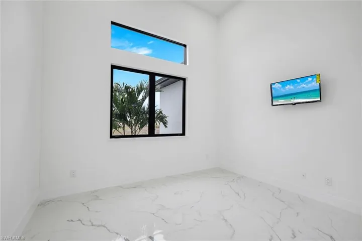 Empty room featuring marble finish flooring