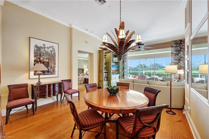 Dining room with crown molding and stunning Bamboo floors