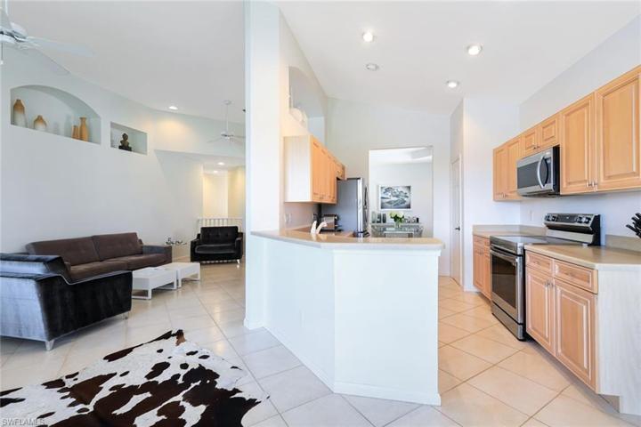 Views of the dining, kitchen and living spaces.