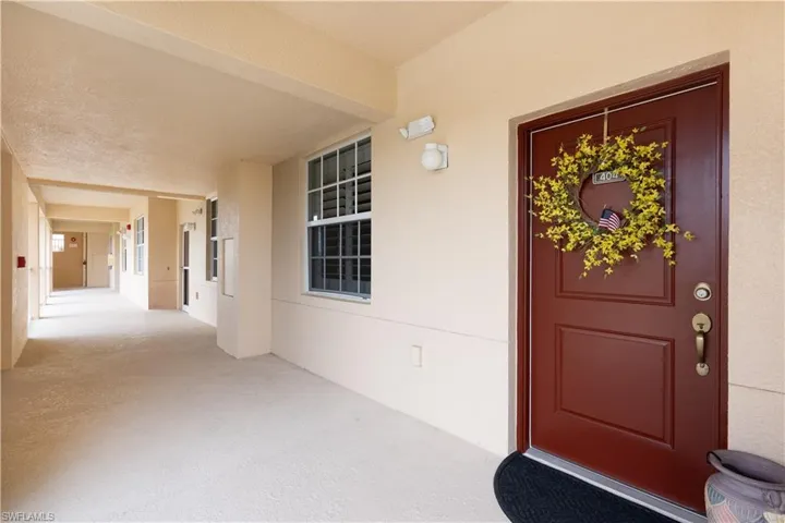 Entrance to property with stucco siding