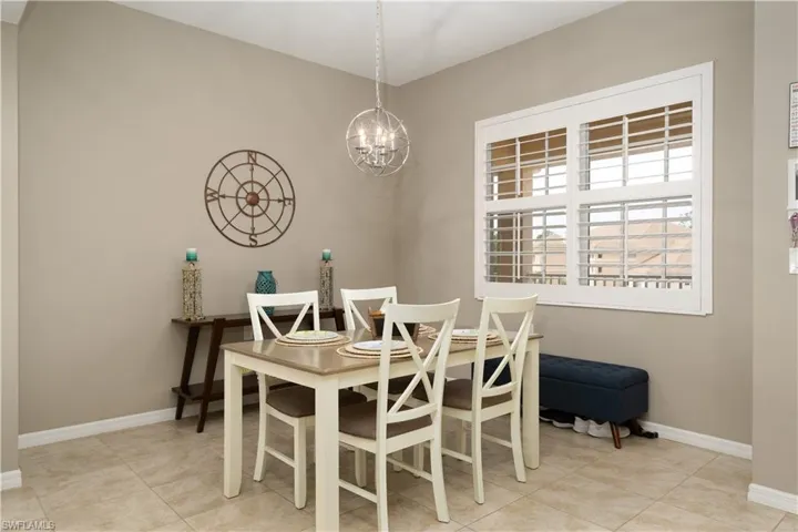 Dining space with a chandelier and light tile patterned floors