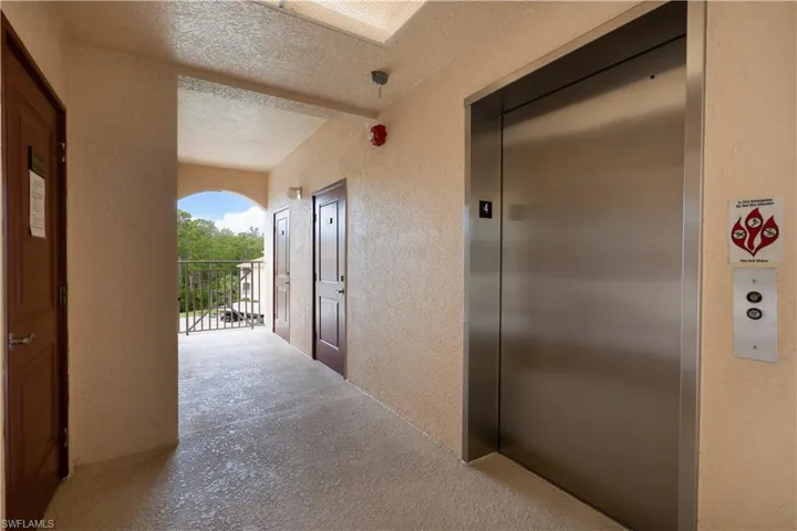 Hallway featuring elevator