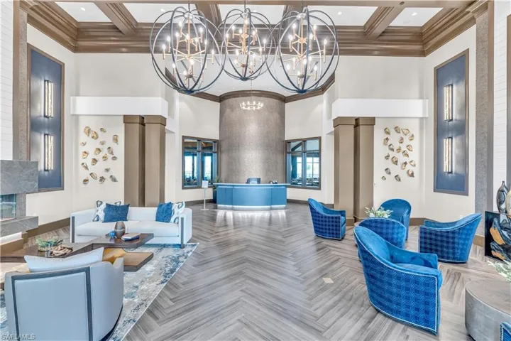 Common area with a high ceiling, coffered ceiling, crown molding, and beamed ceiling