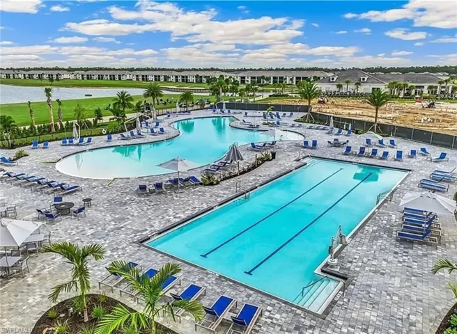 Community pool with a patio