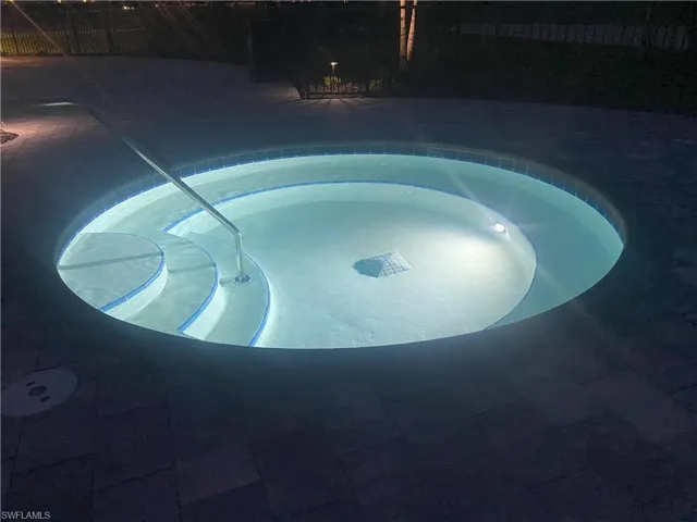 View of pool featuring an in-ground hot tub and a patio