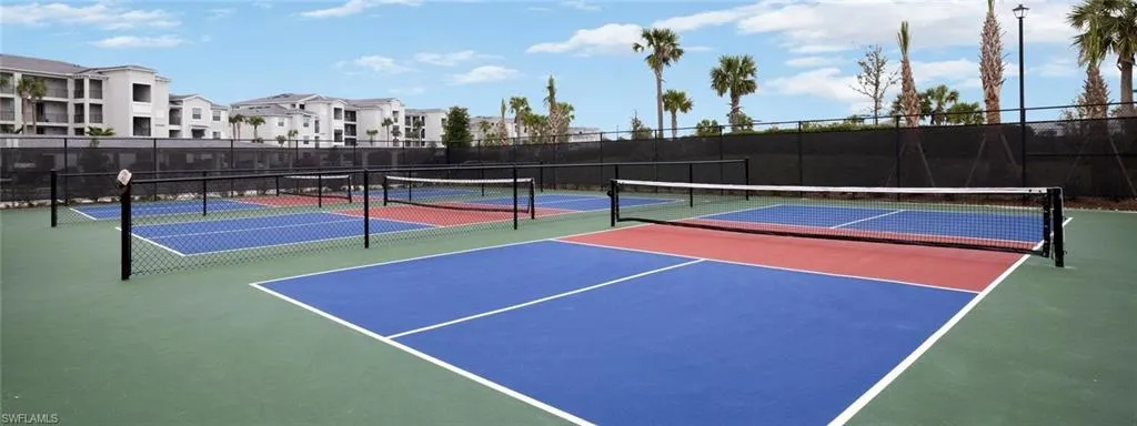 View of tennis court with community basketball court