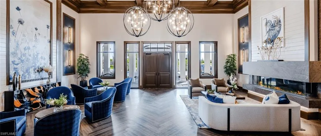 Community lobby featuring beam ceiling, coffered ceiling, a high ceiling, and crown molding