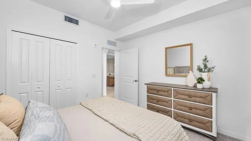 Bedroom with a closet and a ceiling fan