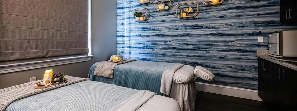 Bedroom with baseboards and wood finished floors