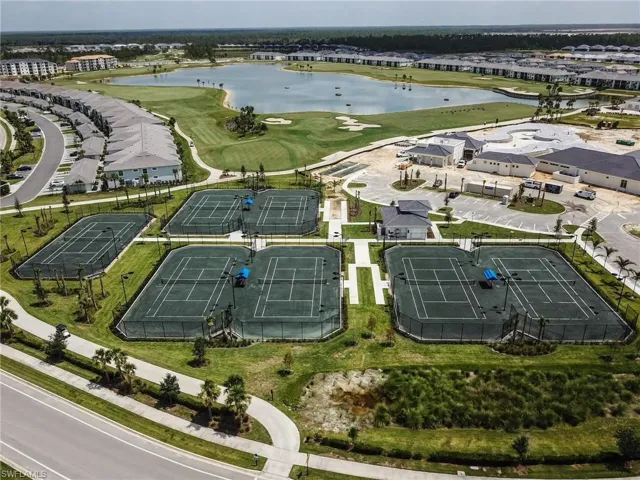 View of property location with a nearby body of water and a local golf course