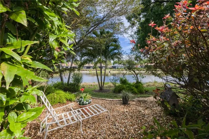 View of yard with a water view