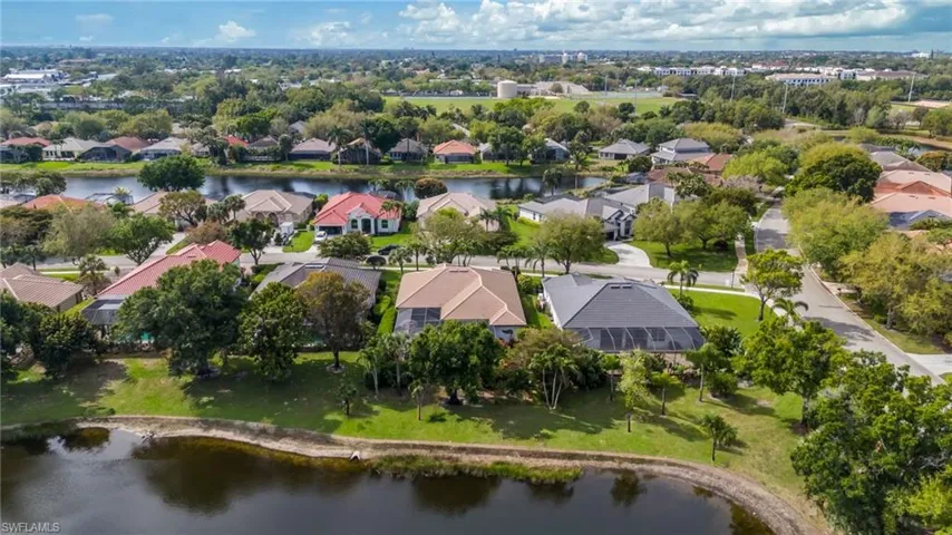 Aerial view of residential area with a nearby body of water