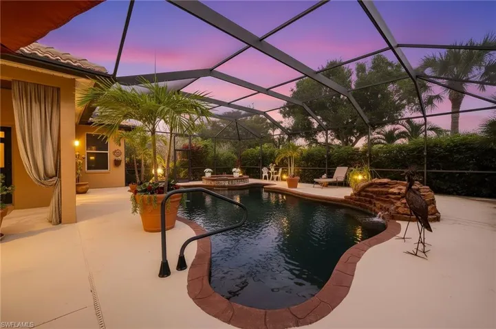 Integrated pool / hot tub with a patio area, a lanai, and a sunroom