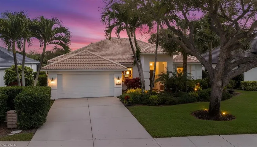 Mediterranean / spanish-style house featuring a garage, stucco siding, a tile roof, concrete driveway, and a yard