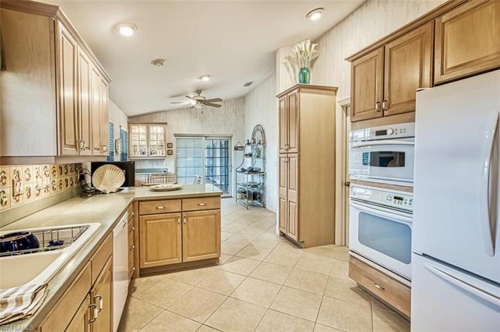 Vaulted Kitchen Opens to Breakfast Area.