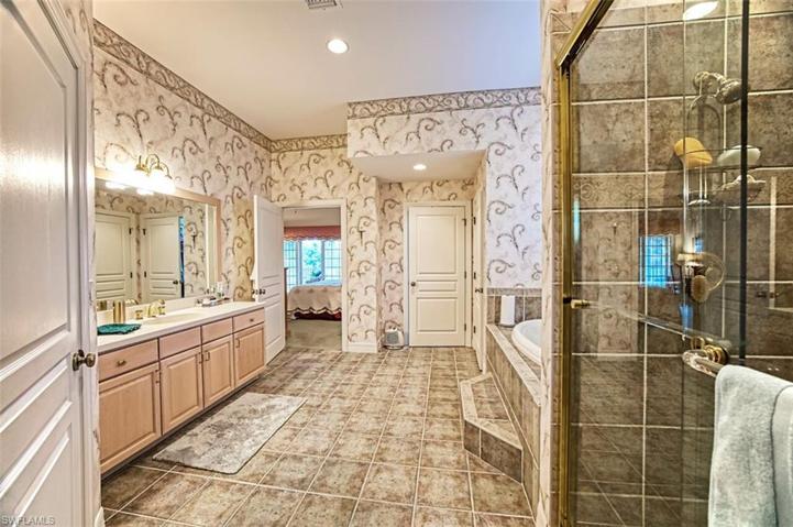 Glass Enclosed Tiled Shower. Relaxing Tub.