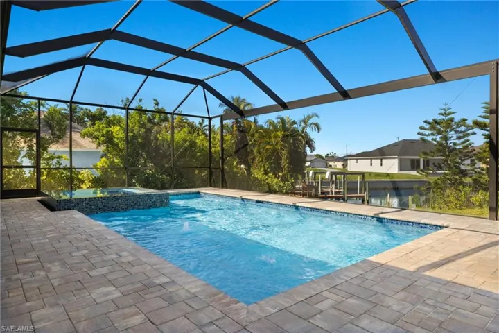 View of pool featuring a patio and a lanai