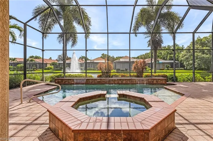 View of swimming pool and beautiful water feature