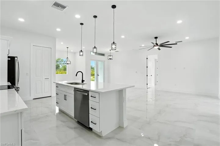 Empty room with light marble finish flooring, recessed lighting, and ceiling fan